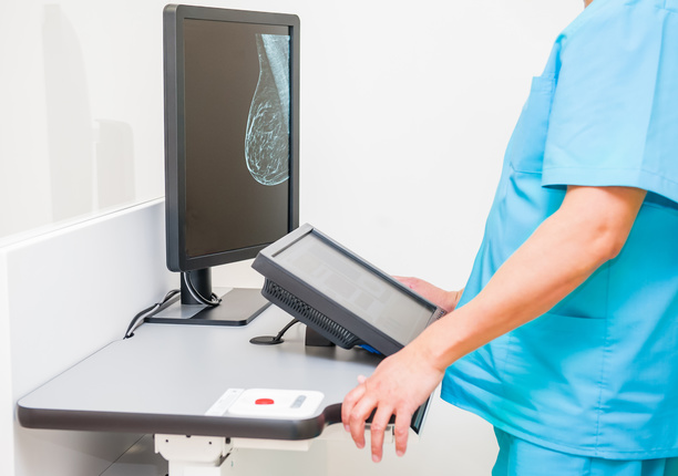 Image of medical healthcare professional reviewing a breast scan