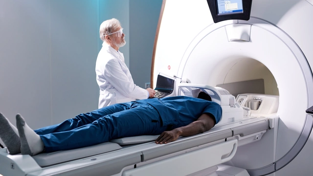 Image of a man going into an MRI scanner