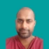 Headshot of consultant Mr Vino Siva on green background