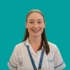 A headshot of Julia Moss, speech and language therapist, on a green background