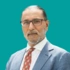 Headshot of consultant Ranjeev Bhangoo, on a green background