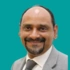 Headshot of consultant Mr Shahnawaz Rasheed on a green background
