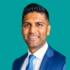 A headshot of consultant Shilen Patel, on a green background