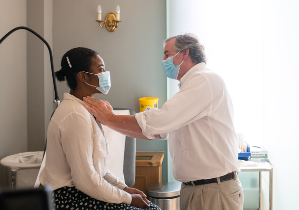 Doctor examines patient