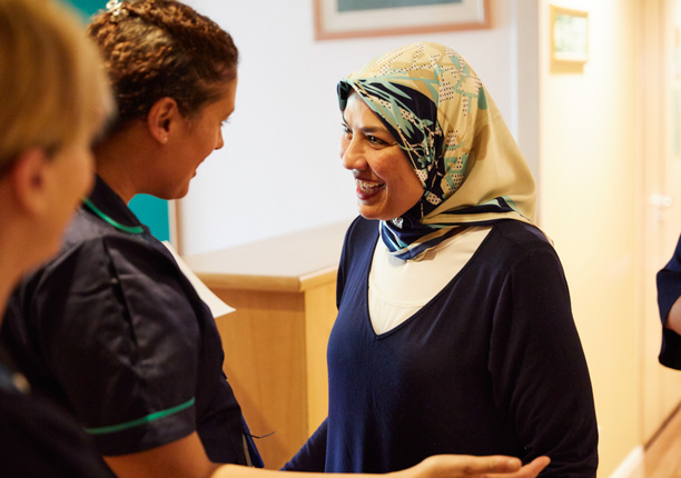 A member of staff greeting a patient