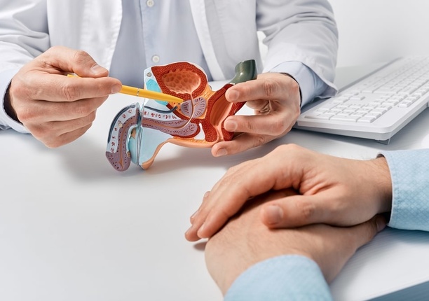 Consultant explaining the treatment process for SpaceOAR hydrogel spacing treatment for prostate cancer, discussing the benefits with the patient.