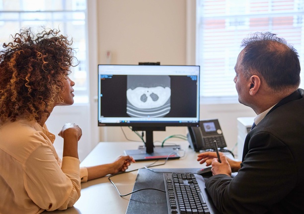 A consultant and patient discussing a lung scan