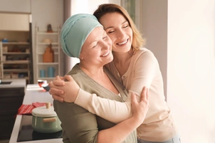 Cancer patient hugged by friend