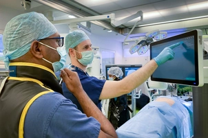 Two doctors looking at a screen