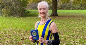 Stella with her award at the Kent Cross Country League championship