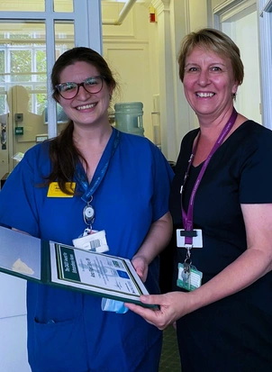 Ana receiving her award from Tonya Kloppers, the Clinic’s Chief Nurse 