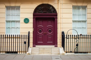 An image of the front of the building for the Rapid Diagnostic Centre at The London Clinic. Purple door with stairs leading up to it