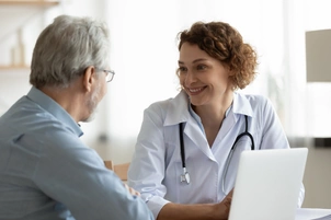 Female doctor consults with male patient