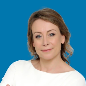 A headshot of Chief People Officer, Candice Cross. Her image sits on a blue background