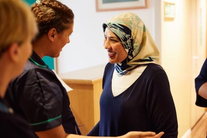 Woman chats with nurse
