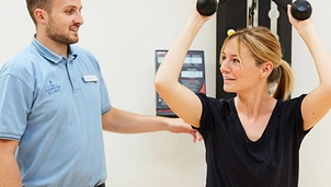 A physiotherapist treats a patient