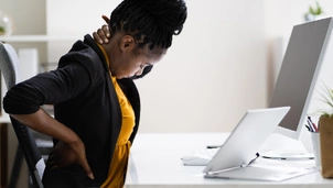 a lady stretches her back and neck