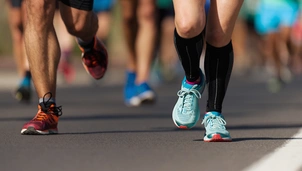 The knees of a crowd of marathon runners