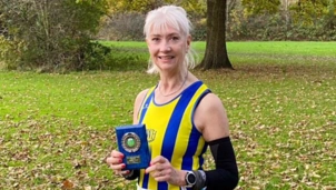 Stella with her award at the Kent Cross Country League championship