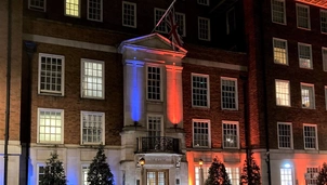 Our main hospital building illuminated blue and orange for World Cancer Day 2023.