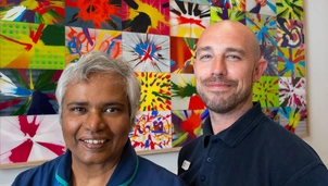 Anita and Dom stand by the spin artwork created on International Nurses Day.