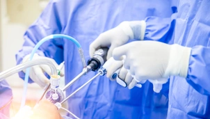 Team of doctor or surgeon in blue gown inside operating room in hospital