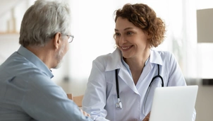 Female doctor consults with male patient