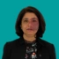 Headshot of consultant Jayshri Shah, on a green background