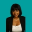 Headshot of consultant Dhanupriya Sivapathasuntharam, on a green background