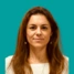 Headshot of consultant Mara Kyrgiou on a green background