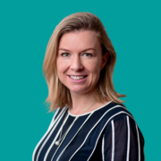A headshot of COO, Sophie Auld. Image placed on a green background
