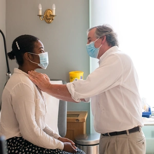 Doctor examines patient