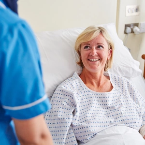patient in bed smiling