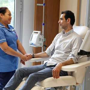 A nurse and patient talking