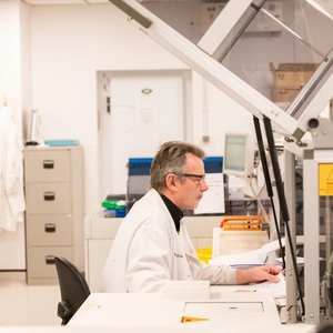 Man looking at a computer screen in a lab