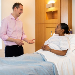 A consultant talking to a patient