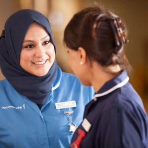 Two nurses talking