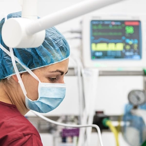 Image of an ICU nurse in a mask