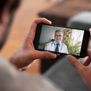 Doctor and patient talking on mobile phone