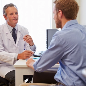 An image of a patient and his doctor discussing prostate cancer diagnosis