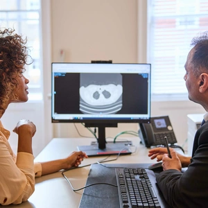 A consultant and patient discussing a lung scan