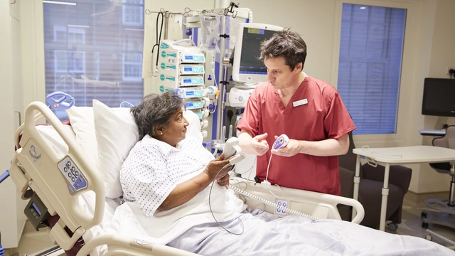 Image of a patient and an ICU doctor talking