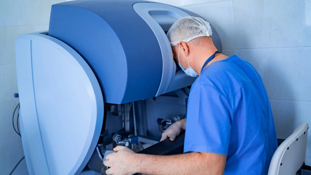 An image of a doctor looking into a microscope